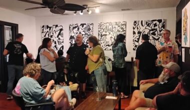 Guests enjoy Alfredo Barranco's artwork.