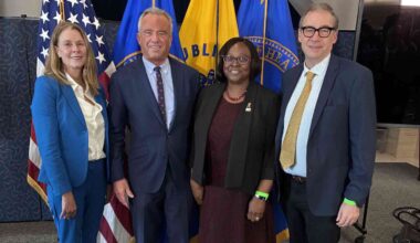 At an event promoting medical school nutrition education, four officials stand side-by-side. From left: Regan Bailey, Robert F. Kennedy, Alma Littles, and Patrick Stover.