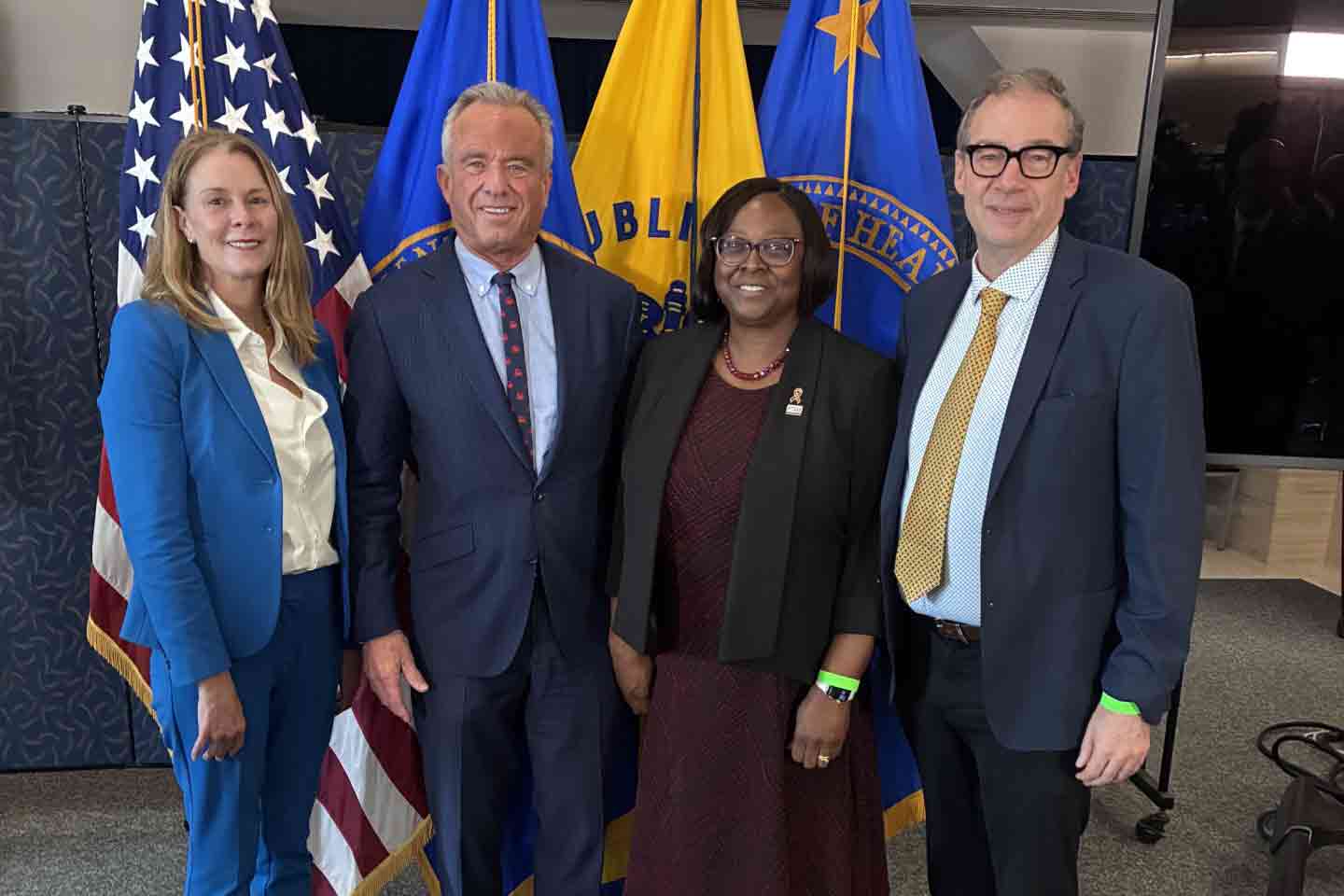 At an event promoting medical school nutrition education, four officials stand side-by-side. From left: Regan Bailey, Robert F. Kennedy, Alma Littles, and Patrick Stover.