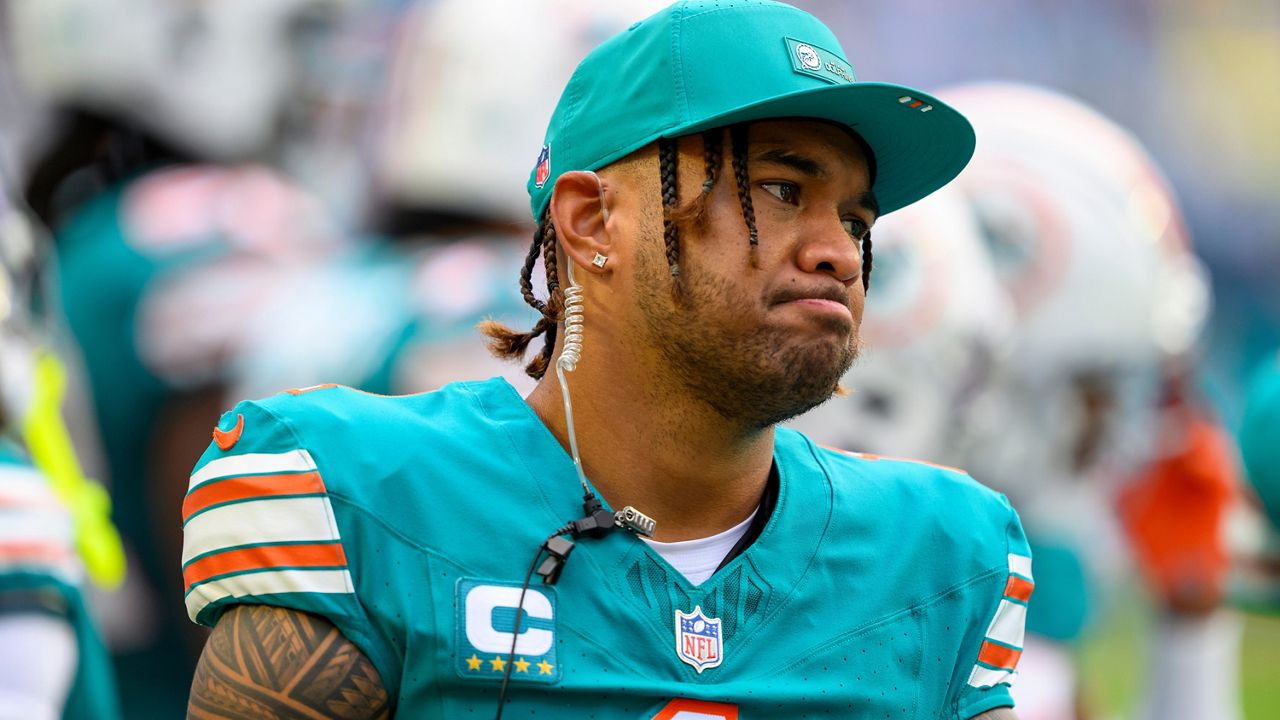 Miami Dolphins quarterback Tua Tagovailoa stood on the sidelines during against the Cincinnati Bengals on Dec. 21 in Miami Gardens, Fla.