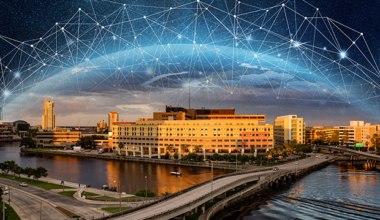 How Tampa General Hospital Accelerates AI Adoption. Tampa General Hospital under an AI web bubble.