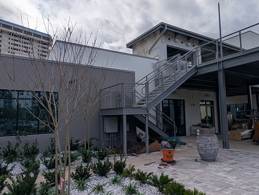 Stairs lead to the rooftop Zorba's Bar at HUB Brooklyn.