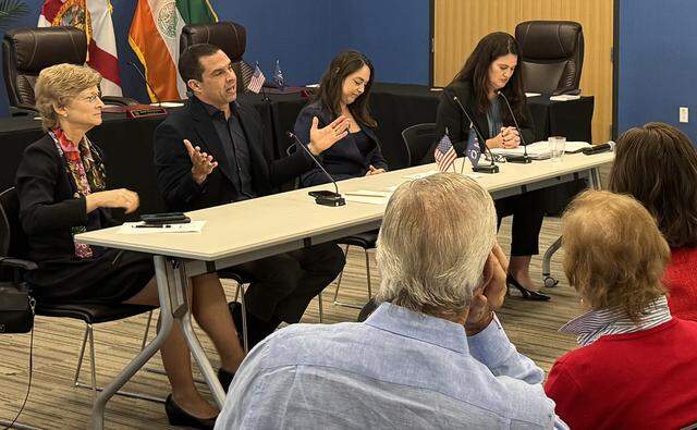 (From left to right) Coral Gables Vice Mayor Rhonda Anderson, Coral Gables Mayor Vince Lago, Miami-Dade County Commissioner Natalie Milian Orbis and Coral Gables City Attorney Cristina Suarez speak during a town hall on Monday, March 9, 2026, in the city’s public safety building about the ballot questions in the upcoming city vote-by-mail election.