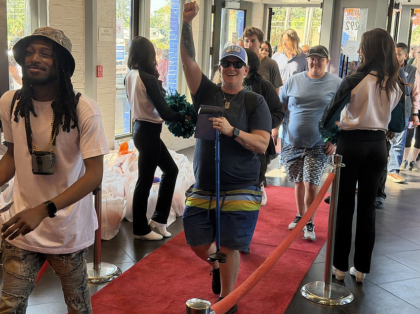 Customers enter Dave & Buster's Jacksonville location at 7025 Salisbury Road on March 27 as the arcade, sports bar and restaurant unveiled a $3 million interior remodeling. The first 125 visitors received a card that allows for a year of free play.
