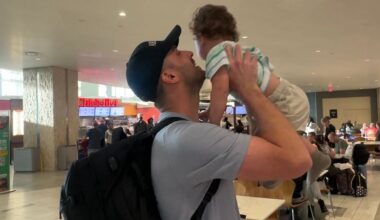 Cody Greene reunites with his son at Tampa International Airport Thursday after being stuck overseas because of the war with Iran. (Spectrum News/Lizbeth Gutierrez)