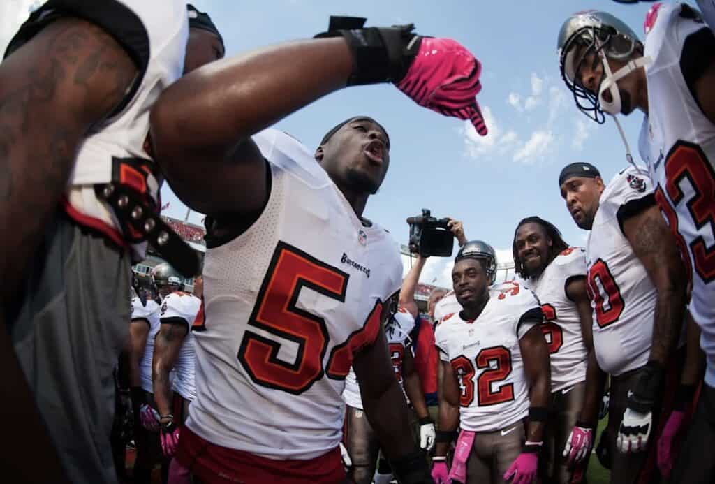 Football player talking to his teammates
