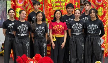 Sifu Mimi Chan (center) poses with her students inside the Wah Lum Kung Fu Temple in Orlando. (Spectrum News/Emma Delamo)