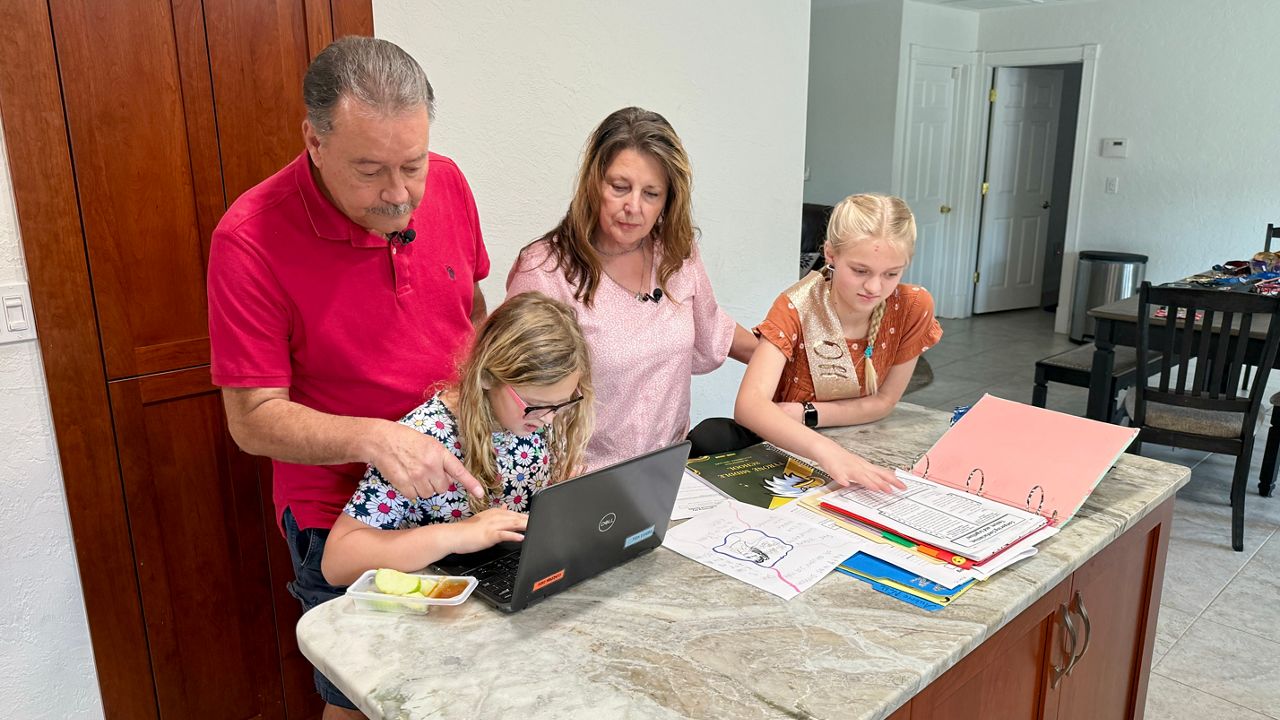 Sherri and Donnie Noble adopted two of their grandchildren after their mother could no longer care for them. (Spectrum News/Erin Murray)