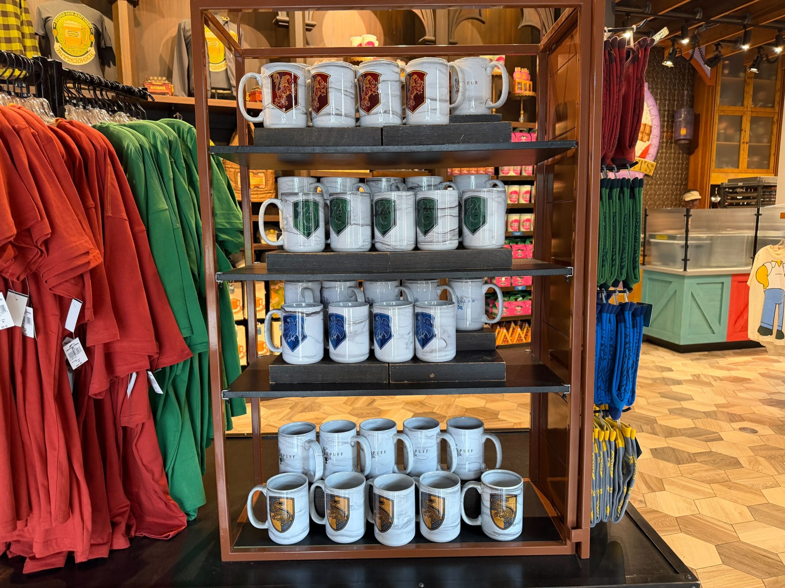 Display of new Hogwarts house coffee mugs at Universal Orlando