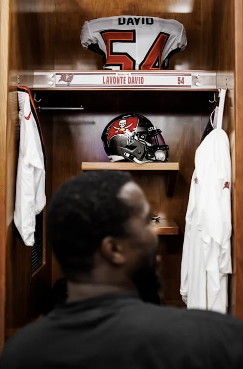 Man sitting at his locker