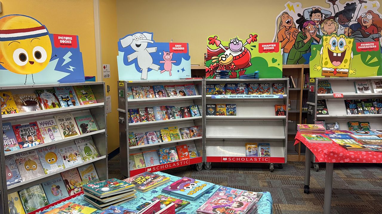 Helena Madsen’s tax-deductible nonprofit, The Giving Shelf, helped about 650 students take home new books, no matter their family’s budget. (Spectrum News 13/Bryanna Howard)