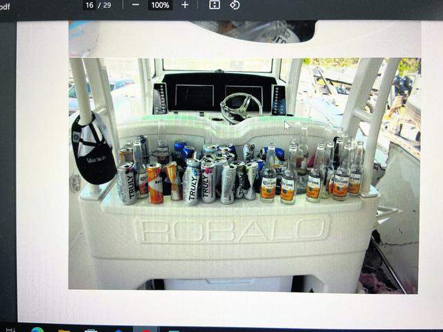 Empty alcohol beverage bottles and cans are lined up behind the cockpit of George Pino’s 29-foot Robalo boat on Sept. 5, 2022, the day after he crashed his boat into a concrete channel marker in Biscayne Bay, killing Lucy Fernandez, a 17-year-old senior at Our Lady of Lourdes Academy.