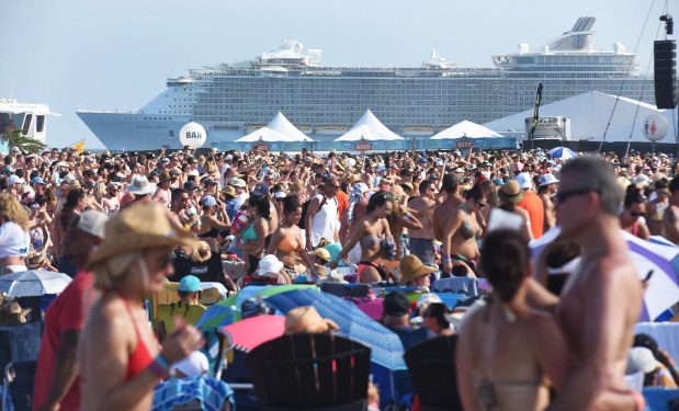 Cruise ships leave Port Everglades as thousands gather for the 2015 Tortuga Music Festival on Fort Lauderdale Beach. 4-12-2015. Fort Lauderdale, FL.
