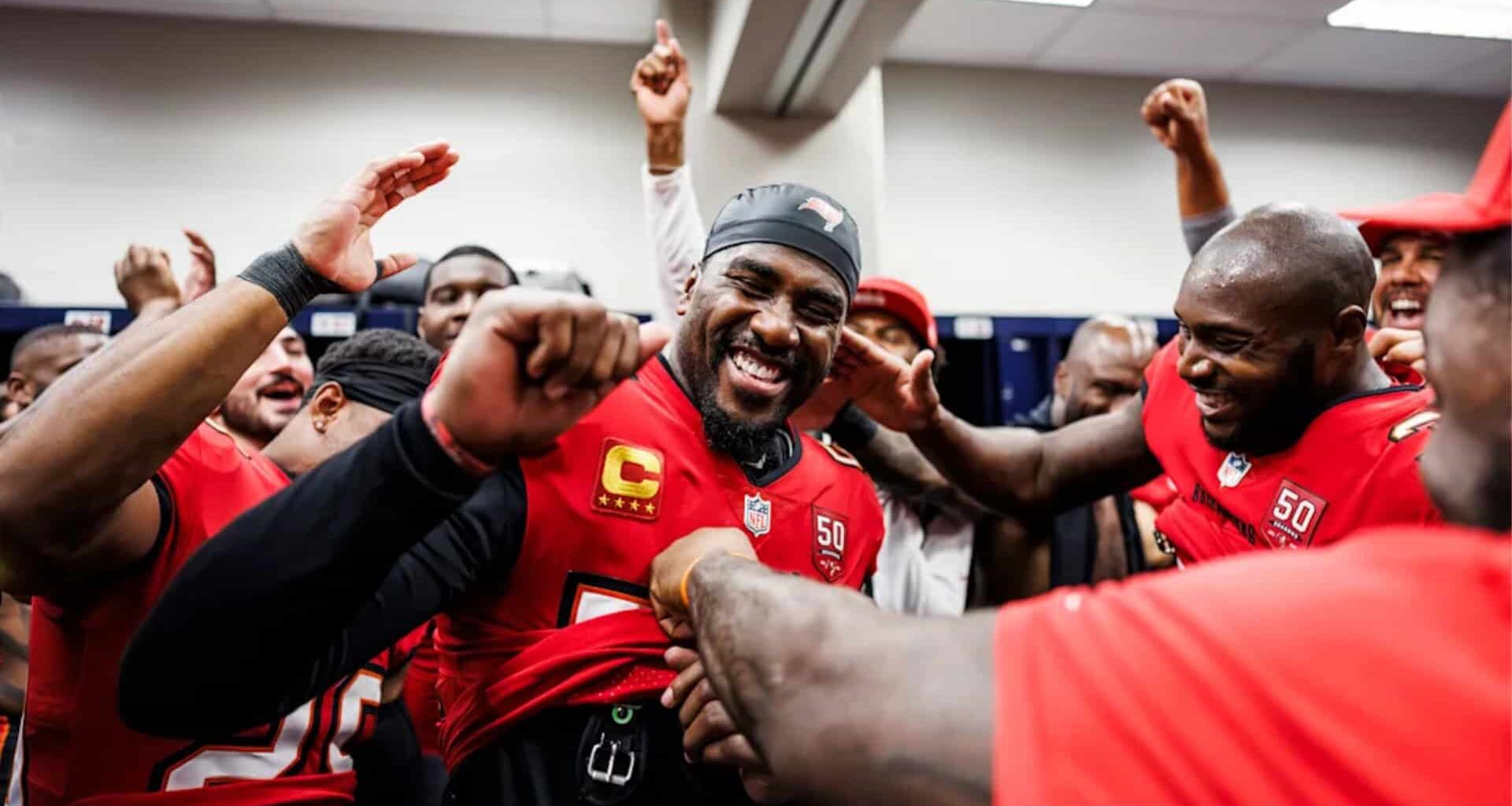 A football captain is praised and cheered by his teammates