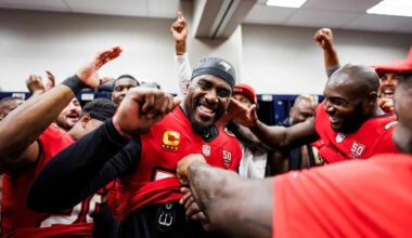 A football captain is praised and cheered by his teammates