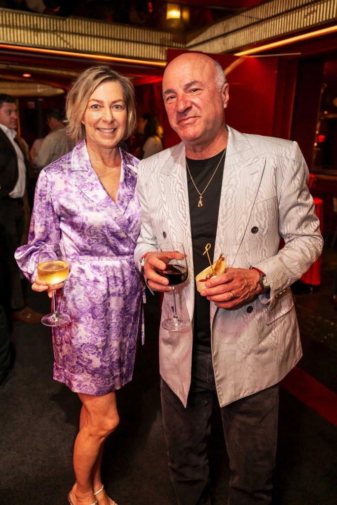 photo of Linda and Kevin O’Leary posing together in formal wear with cocktails