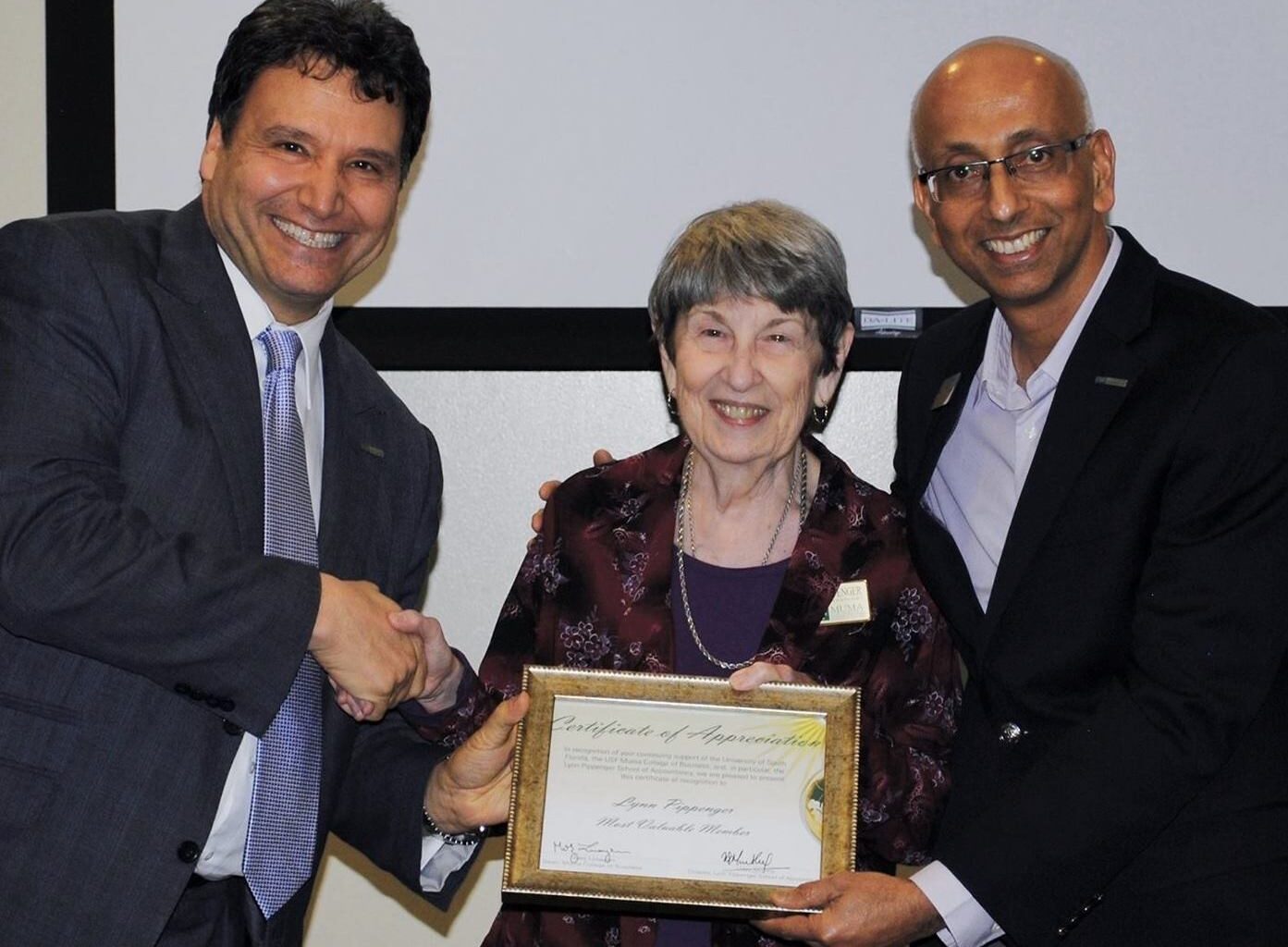 woman receiving award