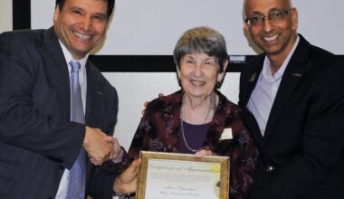 woman receiving award