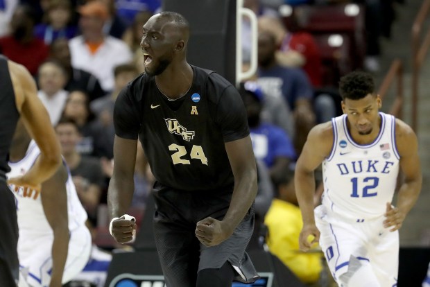 UCF center Tacko Fall celebrates a basket against Duke during the first half of the second-round game of the 2019 NCAA Men's Basketball Tournament at Colonial Life Arena on March 24, 2019, in Columbia, South Carolina. (File photo by Streeter Lecka/Getty Images)