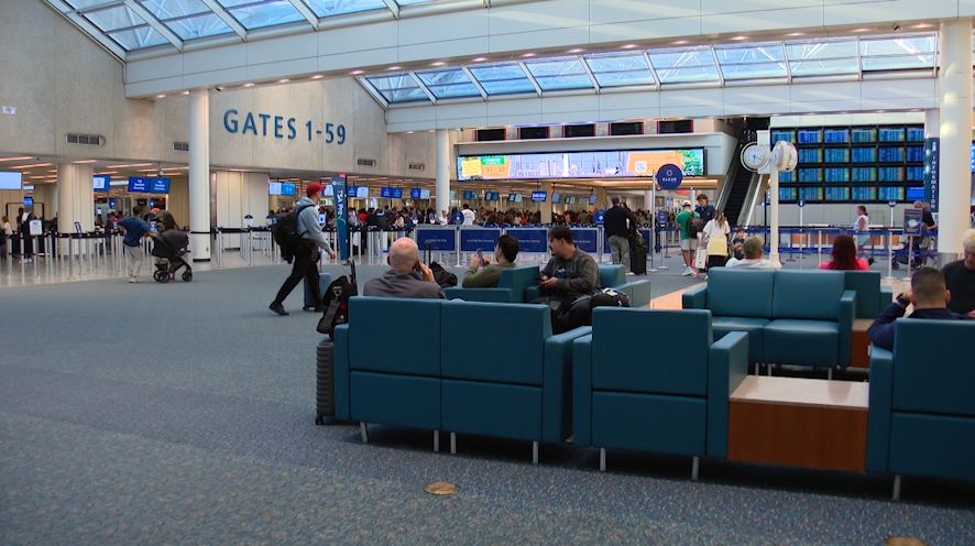 Some travelers at Orlando International Airport experienced delays, cancellations and missed flights Monday as a part of the aftermath from a crash at LaGuardia Airport in New York that killed two. (Spectrum News/Nick Allen)