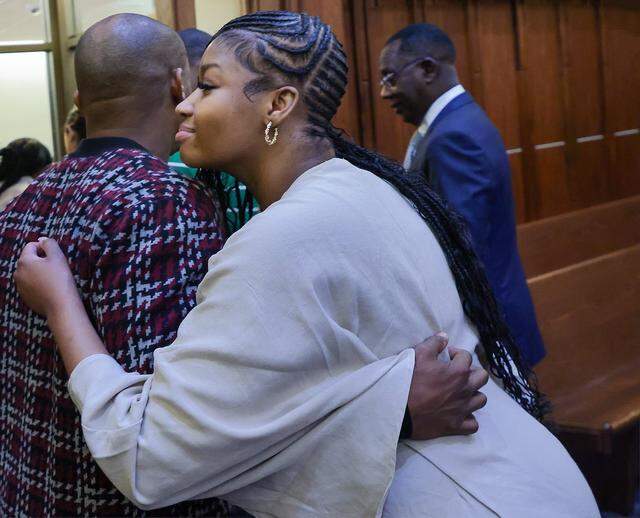 Jahara Malik, center, embraces supporters as she leaves the courtroom after pleading guilty to a manslaughter charge in connection with the 2024 stabbing death of Yahkeim Lollar, a Northwestern student-athlete, in front of Judge Christine Hernandez in Courtroom 2-8 at the Richard E. Gerstein Justice Building on Monday, March 16, 2026, in Miami, Florida.