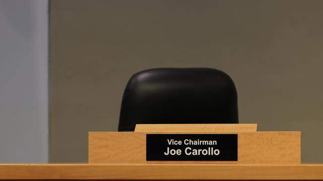 View of Commissioner Joe Carollo's empty chair, during a Commission meeting to discuss important items including a proposal to donate $7.5 million in city services to the World Cup when the games come to Miami Gardens next year.at City Hall, on Thursday November 20, 2025.