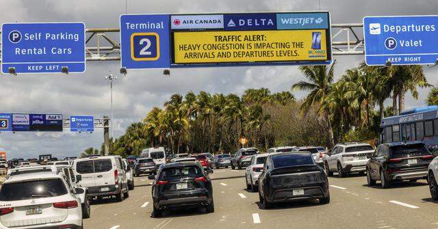 Heavy traffic backs up at the arrivals entrances to terminals at Fort Lauderdale-Hollywood International Airport on Friday, March 20, 2026..