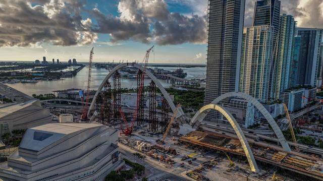 View of the Arsht Center (left bottom) and the ongoing construction of the arches for the I-395 signature bridge as part of the I-395/I-95 Design-Build Project, in Miami, on Saturday, August 16, 2025.