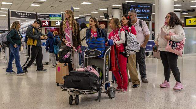 Members from a group of 140 people from across the United States heads to the check point before departing from Miami International Airport to Havana as part of the international Nuestra América Convoy, delivering humanitarian aid to Cuba and protesting U.S. policies, on Friday March 20, 2026.