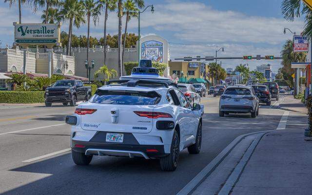View of a Waymo self driving car at SW 8 Street, approaching the iconic Versailles Cuban Cuisine Restaurant, with Miami Herald reporters Catherine Odom and Michael Butler, onboard, as they head to the Brickell Centre, to test the Waymo-Self-Driving Cars - Autonomous Vehicles - Ride-,on Wednesday, February 25, 2026.