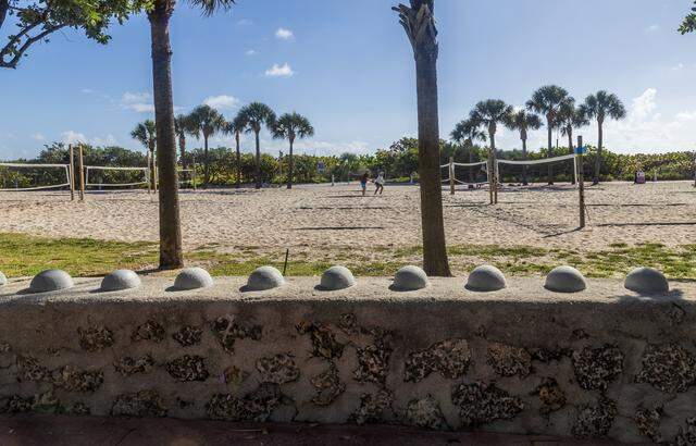 View of round, raised concrete bumps installed by the city of Miami Beach, on low walls around the Unidad of Miami Beach Senior Center, located at 7251 Collins Ave, to prevent homeless people from sitting/lying down, on Tuesday, March 10, 2026.