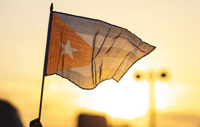 People wave flags as they attend the Free Cuba Rally at Milander Park on Tuesday, March 24, 2026, in Hialeah, Fla. The demonstration, which was organized in part by the City of Hialeah, aims to bring together voices of the Cuban exile community in support of Cuba's freedom.