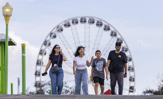 From left to right: Natyia Jimenez, Jahzel Jimenez, Jasaan Jimenez, 9, and Jose Jimenez attend the opening day of the 74th annual Miami-Dade County Youth Fair on Thursday, March 12, 2026, in Miami, Fla.