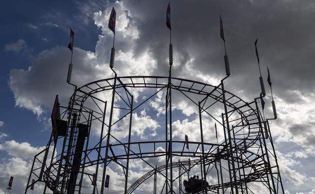 Guests ride the Bullet Train attraction during the opening day of the 74th annual Miami-Dade County Youth Fair on Thursday, March 12, 2026, in Miami, Fla.