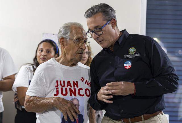 Miami-Dade County Commissioner René García, right, talks with Hialeah City Council member Juan Junco during Interim Mayor Jackie Garcia-Roves' election night party at her campaign headquarters on Tuesday, Nov. 4, 2025, in Hialeah, Fla. Garcia-Roves lost the Hialeah mayoral race to Bryan Calvo.