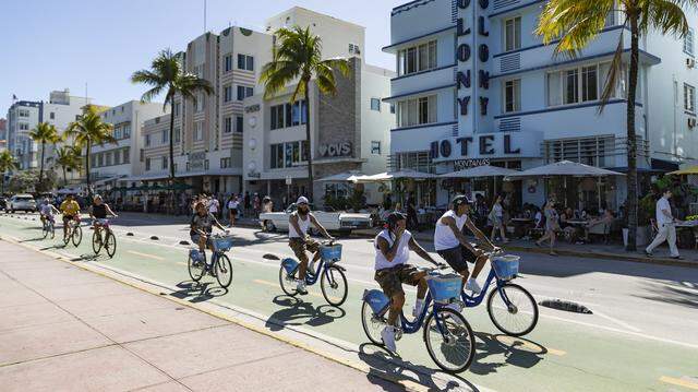 Cyclists make their way down Ocean Drive during spring break on Saturday, March 21, 2026, in Miami Beach, Fla.