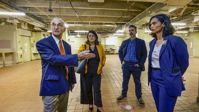 Retired Miami-Dade Judge Steve Leifman, left, gives a tour in January 2025 of a mid-rise building that has been renovated in order to serve people with mental illness at Miami Center for Mental Health and Recovery.  To his left are: Natalia Jaramillo, then communications director for Mayor Daniella Levine Cava; Anthony Escarra, chief of staff for Miami-Dade County Commissioner Raquel Regalado; and Cathy Burgos, the county’s Community Services director.