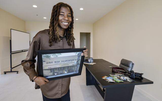 Project Peach, an innovative but compact new building in Overtown combines design flair with three affordable apartments, offices, a retail space on a tiny substandard lot. The building includes community space where the developer is planning an exhibit of Overtown photos by photographer Zykeria Rolle in Miami, Florida, on Tuesday, March 3, 2026. Project Peach building and it's intense peach/salmon color recalls a popular peach soda once produced in overtown by a black-owned company. Project Peach is located at 123 NW 14th Street, in the Overtown area of Miami.