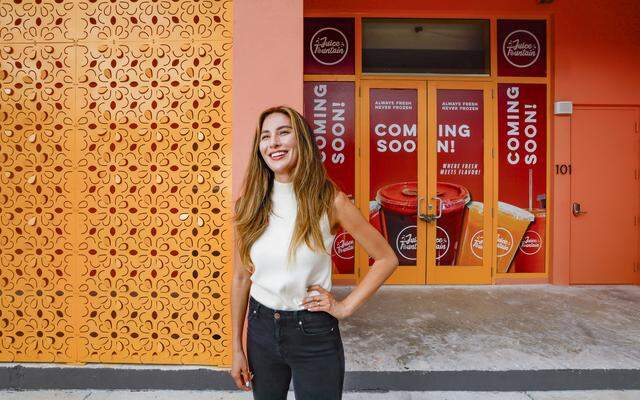 Laura Weinstein-Berman, owner and developer of Project Peach, an innovative but compact new building in Overtown that combines design flair with three affordable apartments, offices, a retail space on a small substandard lot. It's an intense peach/salmon color that recalls a popular peach soda once produced in overtown by a black-owned company. The building, which recently opened, also includes community space where the developer is planning an exhibit of Overtown photos in Miami, Florida, on Tuesday, March 3, 2026. Project Peach building is located at 123 NW 14th Street, in the Overtown area of Miami.