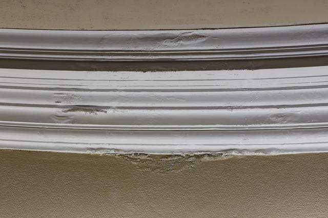 Wood ceiling moldings in the commission chamber at Coral Gables City Hall show signs of water damage from leaks that plague the historic building, which will undergo a comprehensive restoration expected take up to three years.