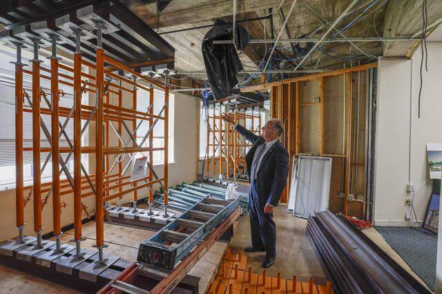 Coral Gables City Manager Peter J. Iglesias points out temporary structural reinforcements installed in Coral Gables City Hall in preparation for a comprehensive renovation, the first since the historic building opened in 1928.