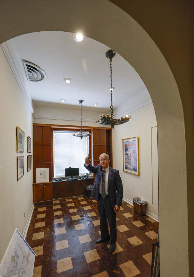 Coral Gables City Manager Peter J. Iglesias shows off a previously restored office in City Hall, which will undergo a full interior and exterior renovation that’s expected to take up to three years. Like the renovation of this office, part of the original mayor’s suite, the project will restore the historic City Hall’s interiors to their original look.