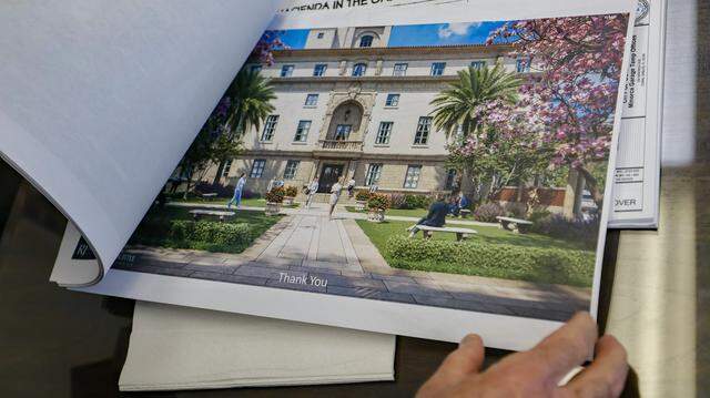 Coral Gables City Manager Peter J. Iglesias looks through renovation and restoration plans on Wednesday, March 4, 2026. 