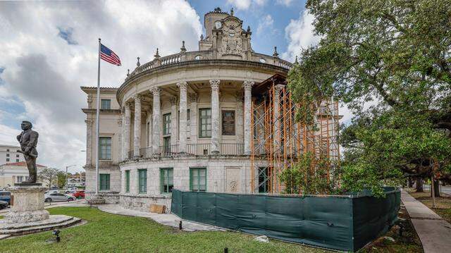 Support scaffolding holds up four cracking Corinthian columns at Coral Gables City Hall, which is being vacated for a full restoration that’s expected to take up to three years. It’s the first extensive renovation for the historic building since it opened in 1928.