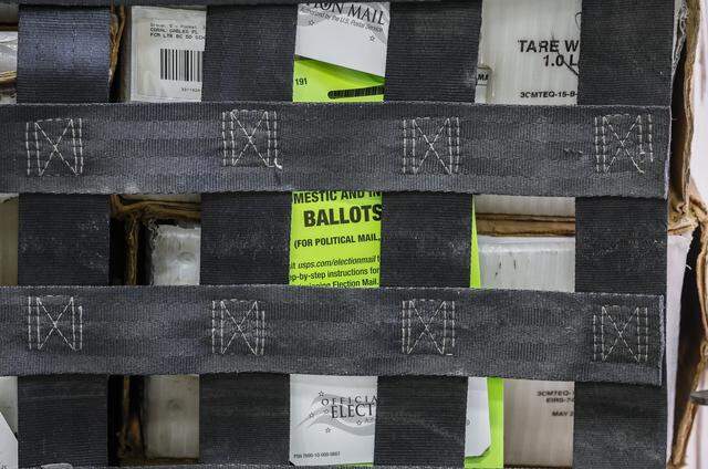 Carts full of vote-by-mail ballots are loaded onto a USPS truck at the Miami-Dade Supervisor of Elections Office in Doral, Florida, on Thursday, March 19, 2026.  The ballots will be delivered to voters for the upcoming city of Coral Gables election.