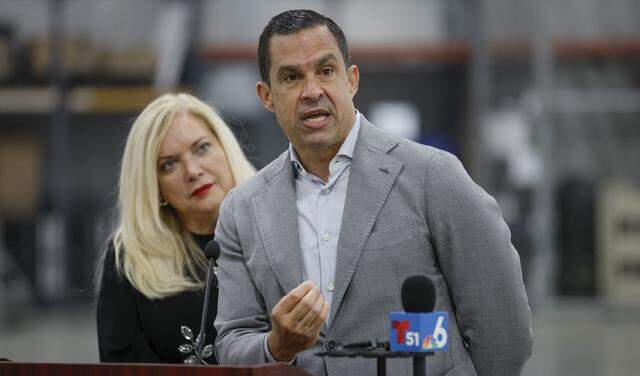 Miami-Dade Supervisor of Elections Alina Garcia listens as Coral Gables Mayor Vince C. Lago speaks to reporters after vote-by-mail ballots were loaded onto a USPS truck at the Miami-Dade Supervisor of Elections Office in Doral, Florida, on Thursday, March 19, 2026. The ballots will be delivered to voters by mail for the upcoming April 21 Coral Gables election.