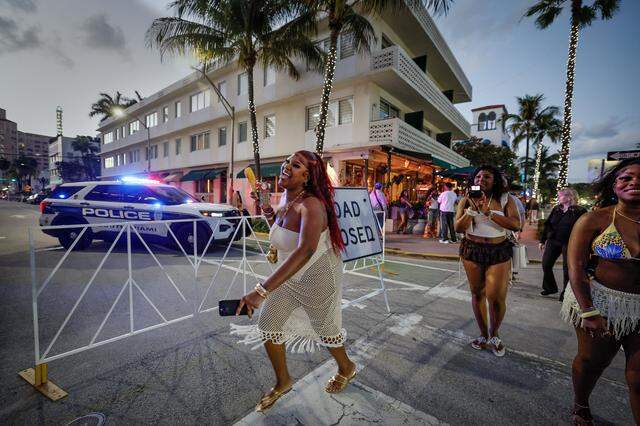 Traneicia Johnson, a student at Palm Beach State College, crosses 8th Street on Ocean Drive with her friends, Naomi Cadet of FSU and Day Cooper of FAMU, seen left to right, during spring break on South Beach, in Miami Beach, Florida on Friday, March 20, 2026.