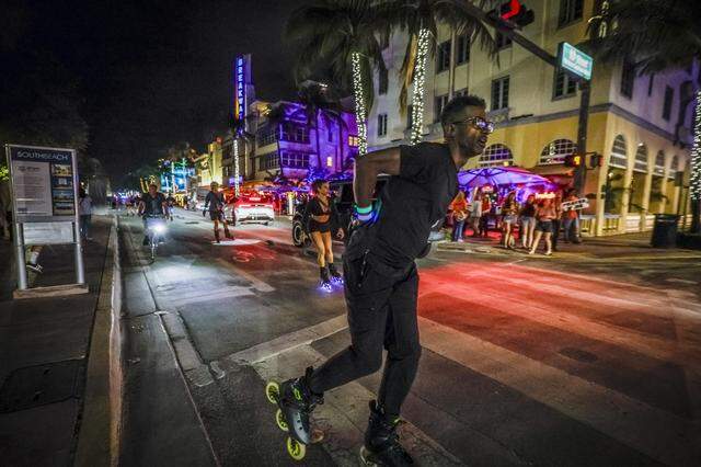 Roller skaters skate along Ocean Drive during spring break in South Beach on Friday, March 20, 2026.