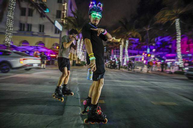 Roller skaters skate along Ocean Drive during spring break in the South Beach neighborhood of Miami Beach Florida on Friday, March 20, 2026.