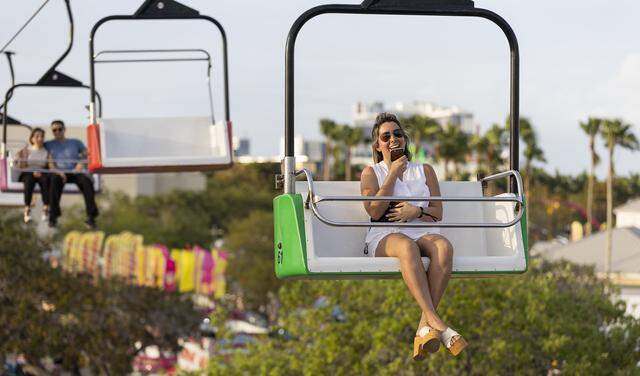 Guests ride a zip line during the opening day of the 74th annual Miami-Dade County Youth Fair on Thursday, March 12, 2026, in Miami, Fla.